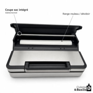 Kitchen vacuum sealer with built?in bag cutter and roll holder, lid raised to show interior