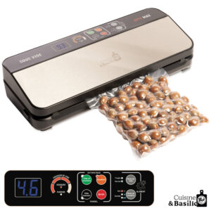 Vacuum sealer sealing a bag of hazelnuts, showing the device's control panel and a filled plastic pouch nearby.