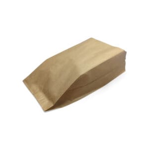 Brown kraft paper bag lying flat on a white background, empty and unfolded.